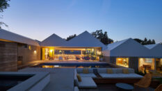 House Stepping Down a Hill by Bestor Architecture, exterior at sumset