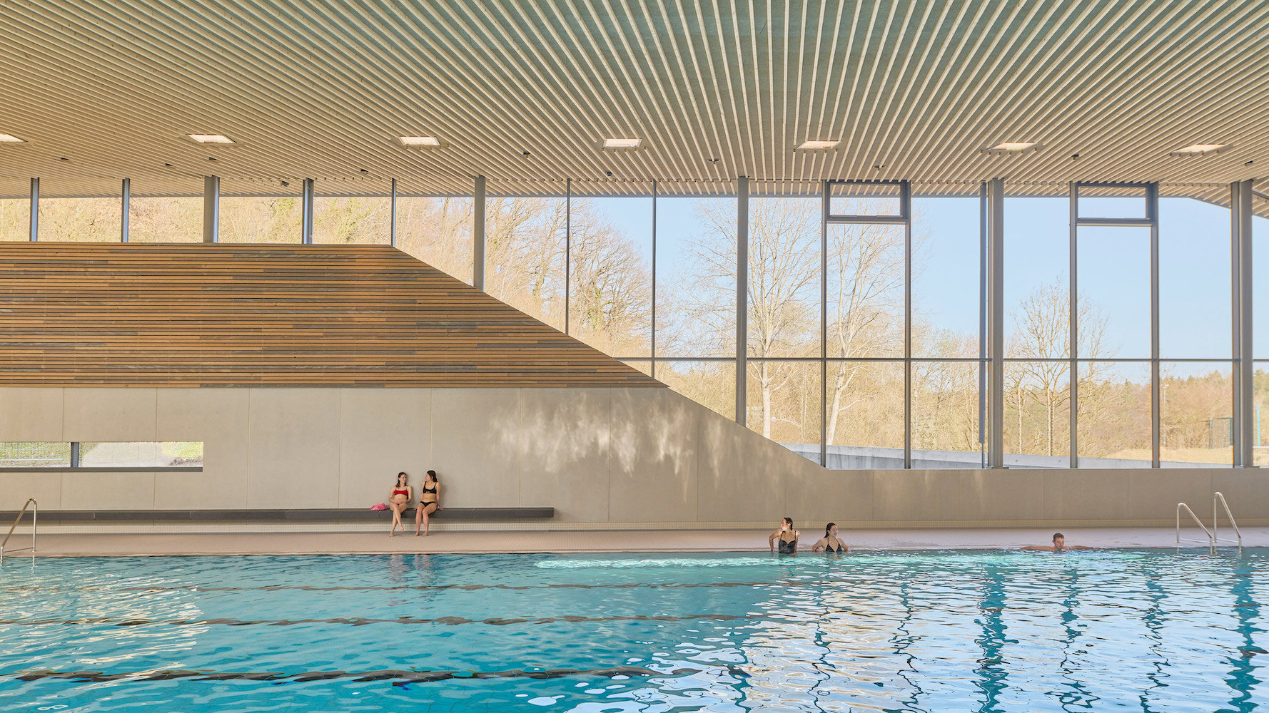Behnisch Architekten's Schwaketenbad Aquatic Center Puts a Pool-Packed Program Under Three Distinct Roofs
